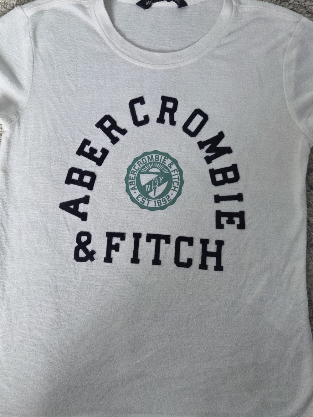 Abercrombie & Fitch White Tee with Navy Arch Logo and Green Crest Patch